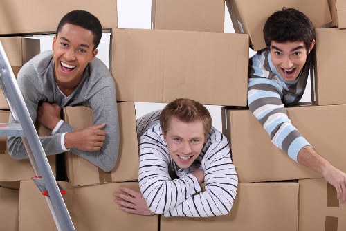 Furniture being carefully loaded into a moving van in Barnes