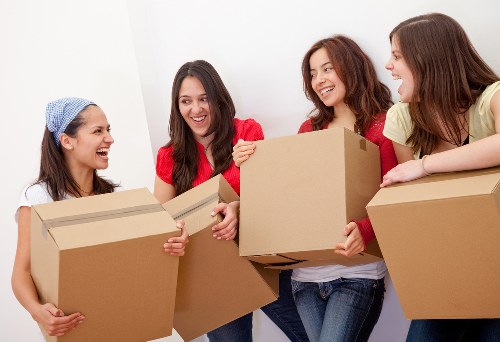 Local movers unloading boxes at a Barnes property