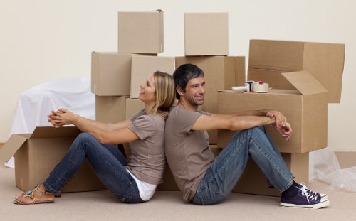 Organised unpacking of boxes in a Barnes property after moving day