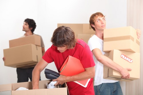 Movers preparing household items for a flat removal in Barnes