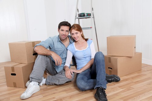 Packed office furniture and equipment ready for a business move in Barnes