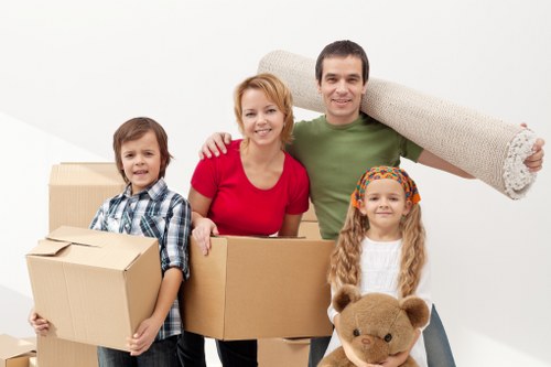 Careful wrapping of fragile household items before a Barnes relocation