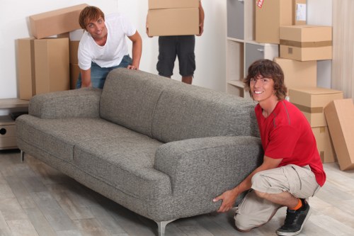 Moving large furniture through a Barnes home with tight access