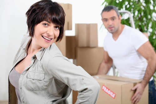 Trained staff using moving equipment during a safe removal job