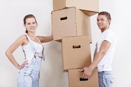Local moving team loading furniture into a van in Barnes